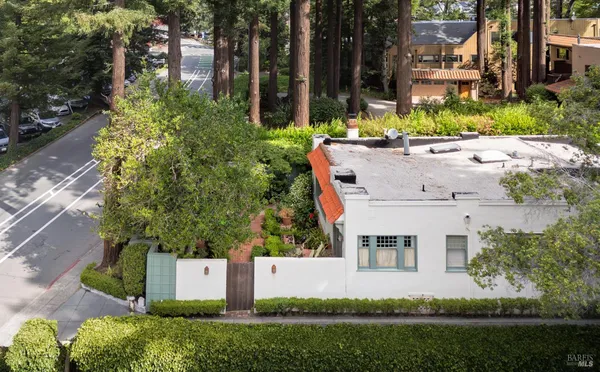 an aerial view of a house with a yard