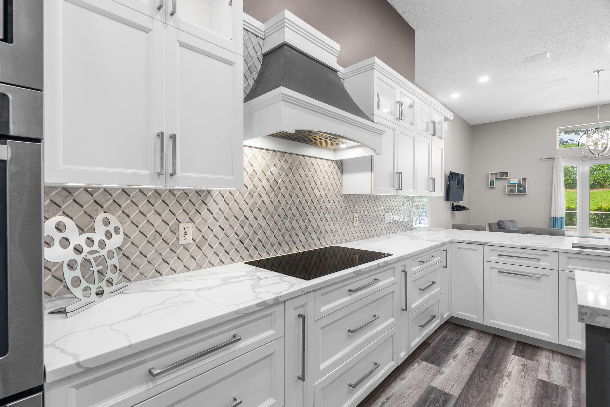 19916 Dinner Key Drive Boca Raton, FL 33498 - Photo 11 of 73 a kitchen with granite countertop white cabinets and white appliances