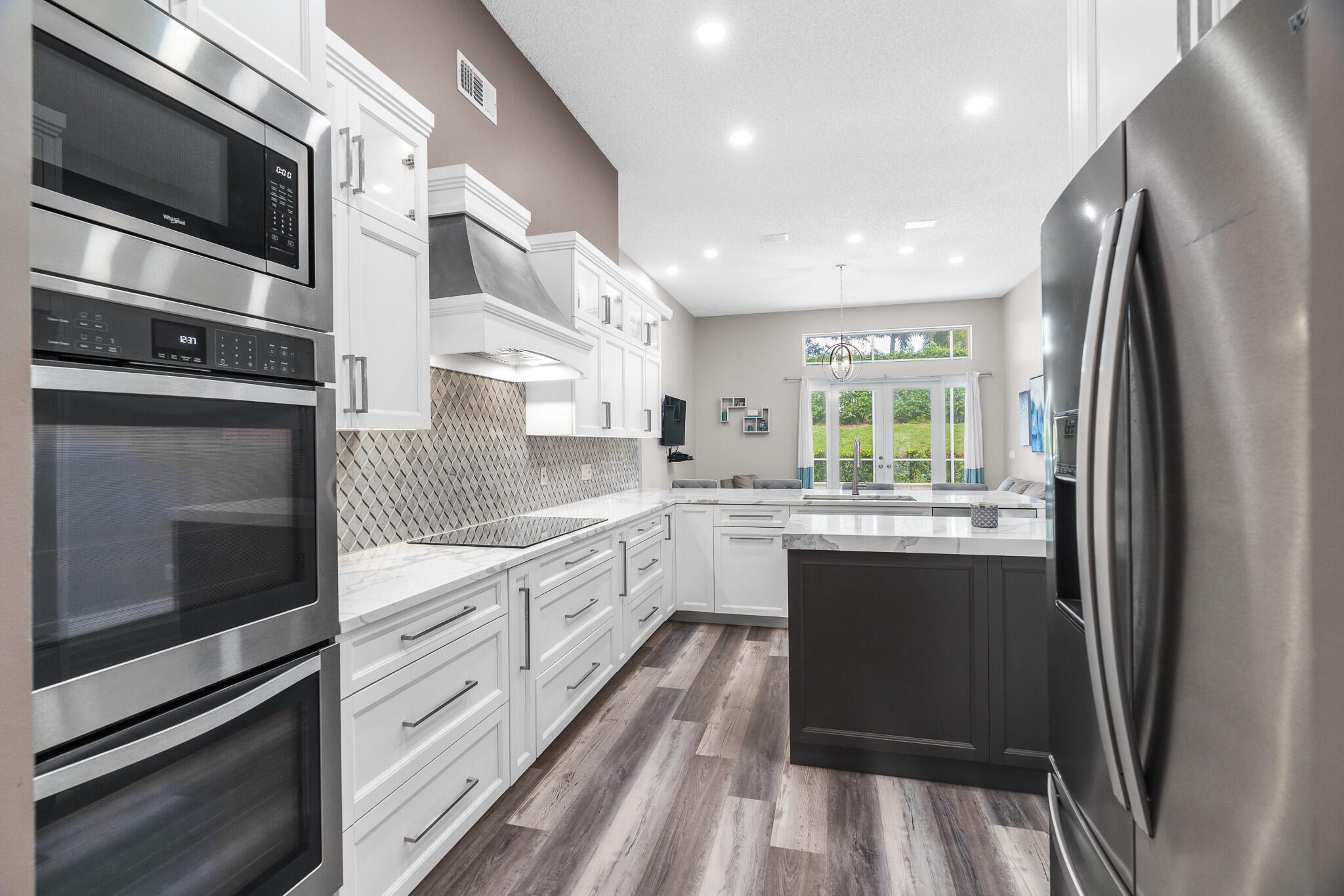 19916 Dinner Key Drive Boca Raton, FL 33498 - Photo 12 of 73 a kitchen with stainless steel appliances granite countertop a refrigerator and a sink