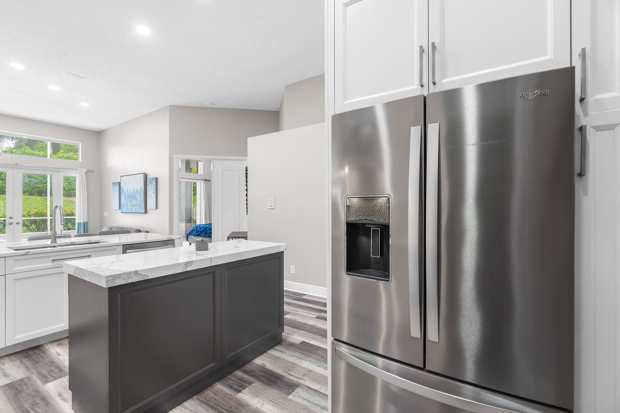 19916 Dinner Key Drive Boca Raton, FL 33498 - Photo 13 of 73 a kitchen with stainless steel appliances granite countertop a refrigerator and a sink