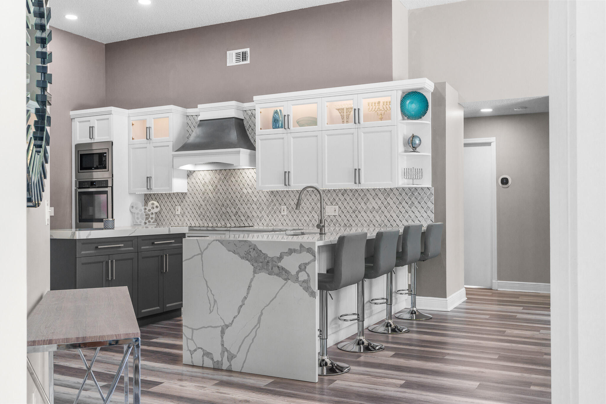 19916 Dinner Key Drive Boca Raton, FL 33498 - Photo 38 of 73 a kitchen with a cabinets and chairs