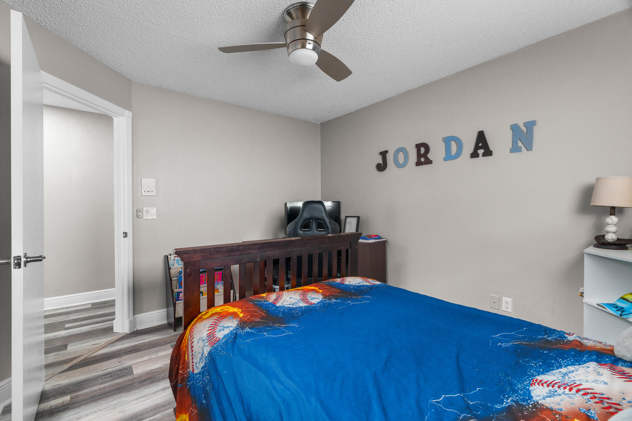 19916 Dinner Key Drive Boca Raton, FL 33498 - Photo 47 of 73 a bedroom with a bed and wooden floor