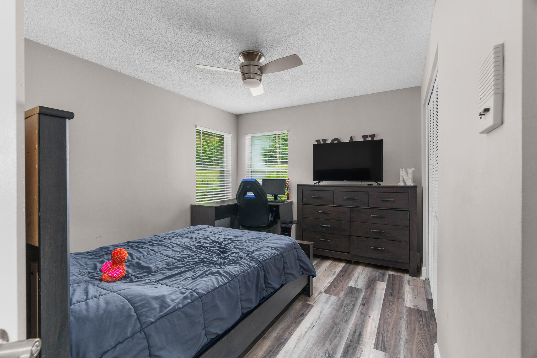 19916 Dinner Key Drive Boca Raton, FL 33498 - Photo 48 of 73 a bedroom with a bed and wooden floor