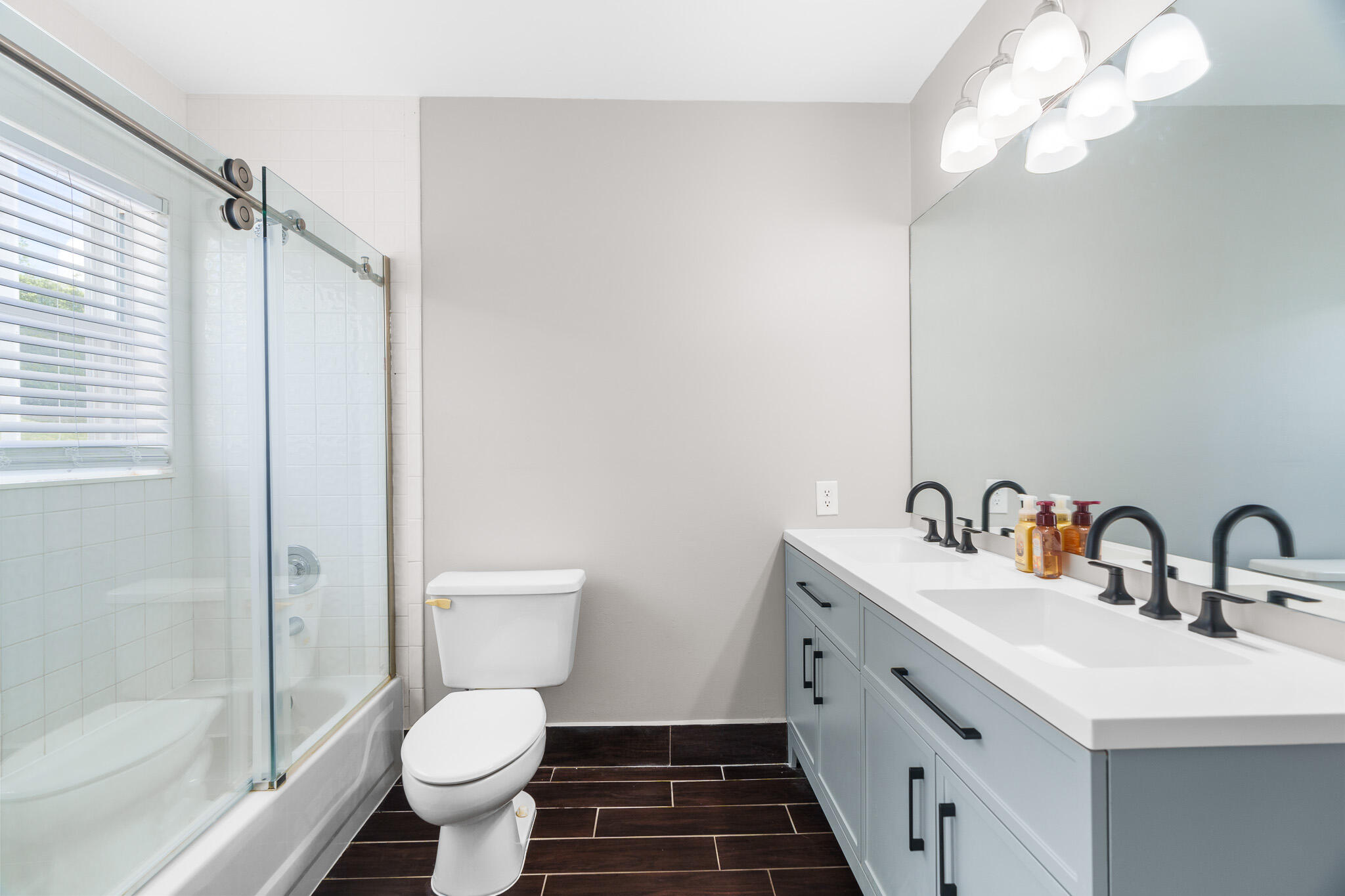 19916 Dinner Key Drive Boca Raton, FL 33498 - Photo 52 of 73 a bathroom with a double vanity sink toilet and shower