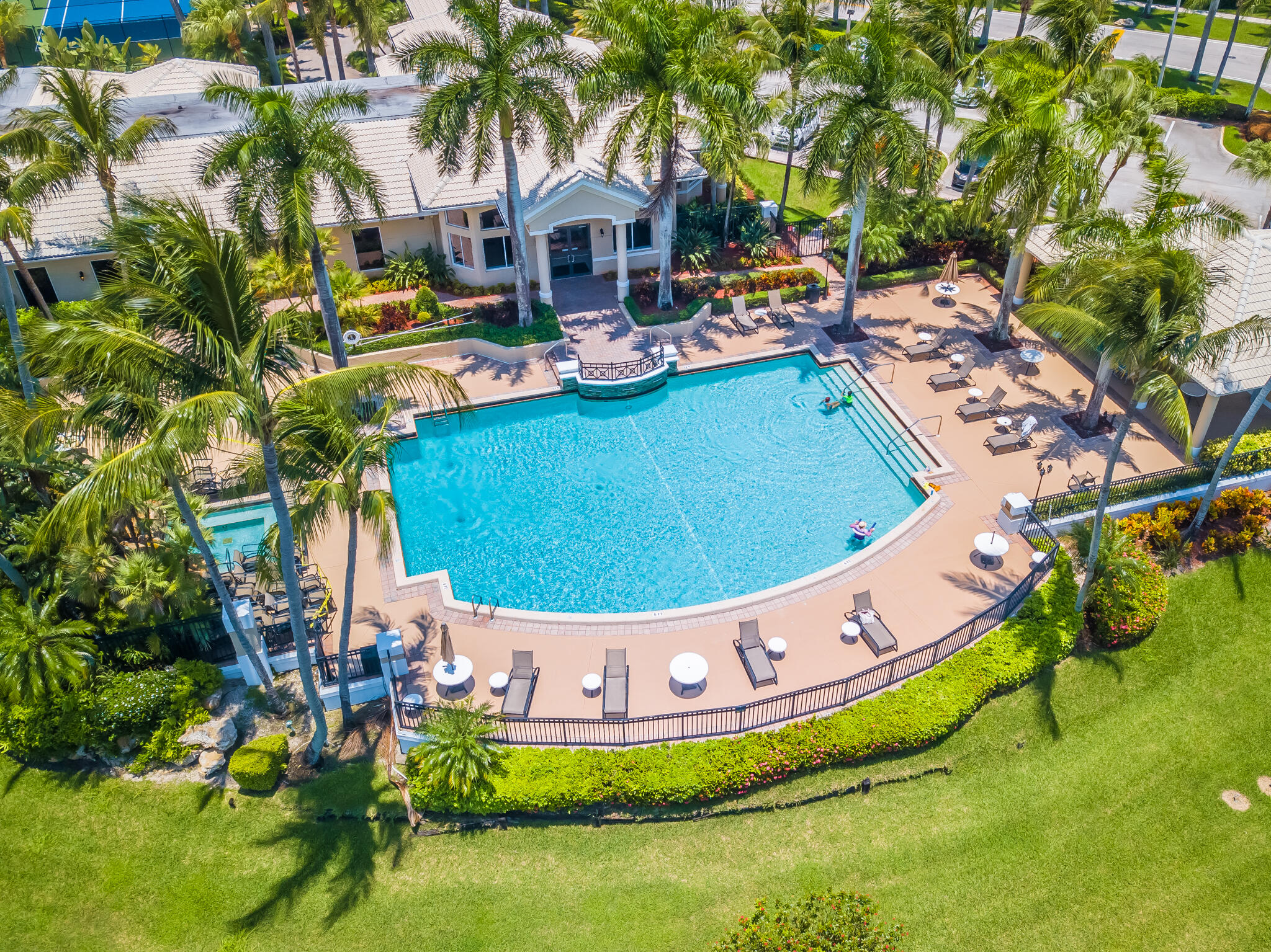 19916 Dinner Key Drive Boca Raton, FL 33498 - Photo 57 of 73 a view of a swimming pool with a yard and sitting area