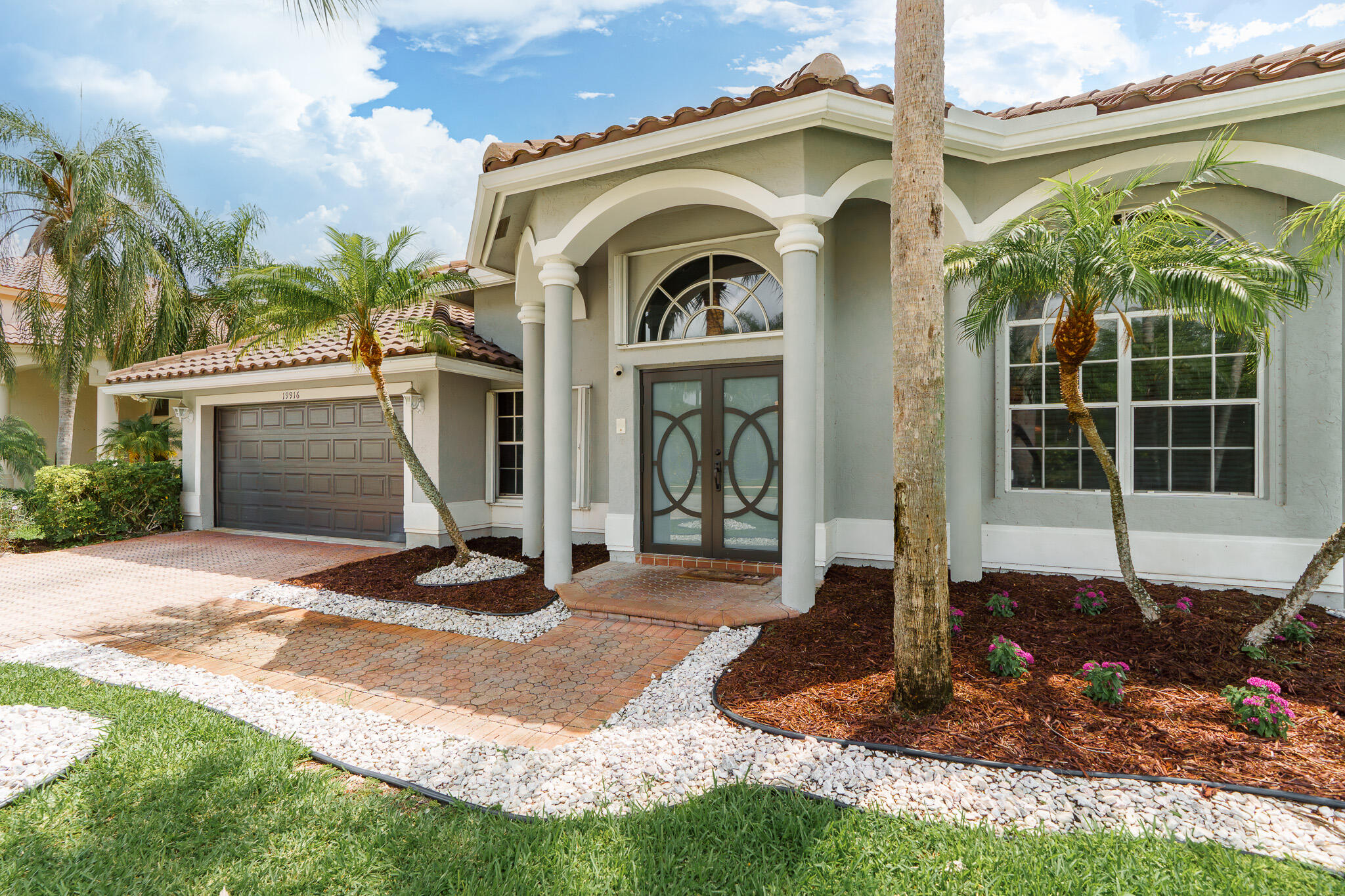 19916 Dinner Key Drive Boca Raton, FL 33498 - Photo 6 of 73 a front view of a house with garden