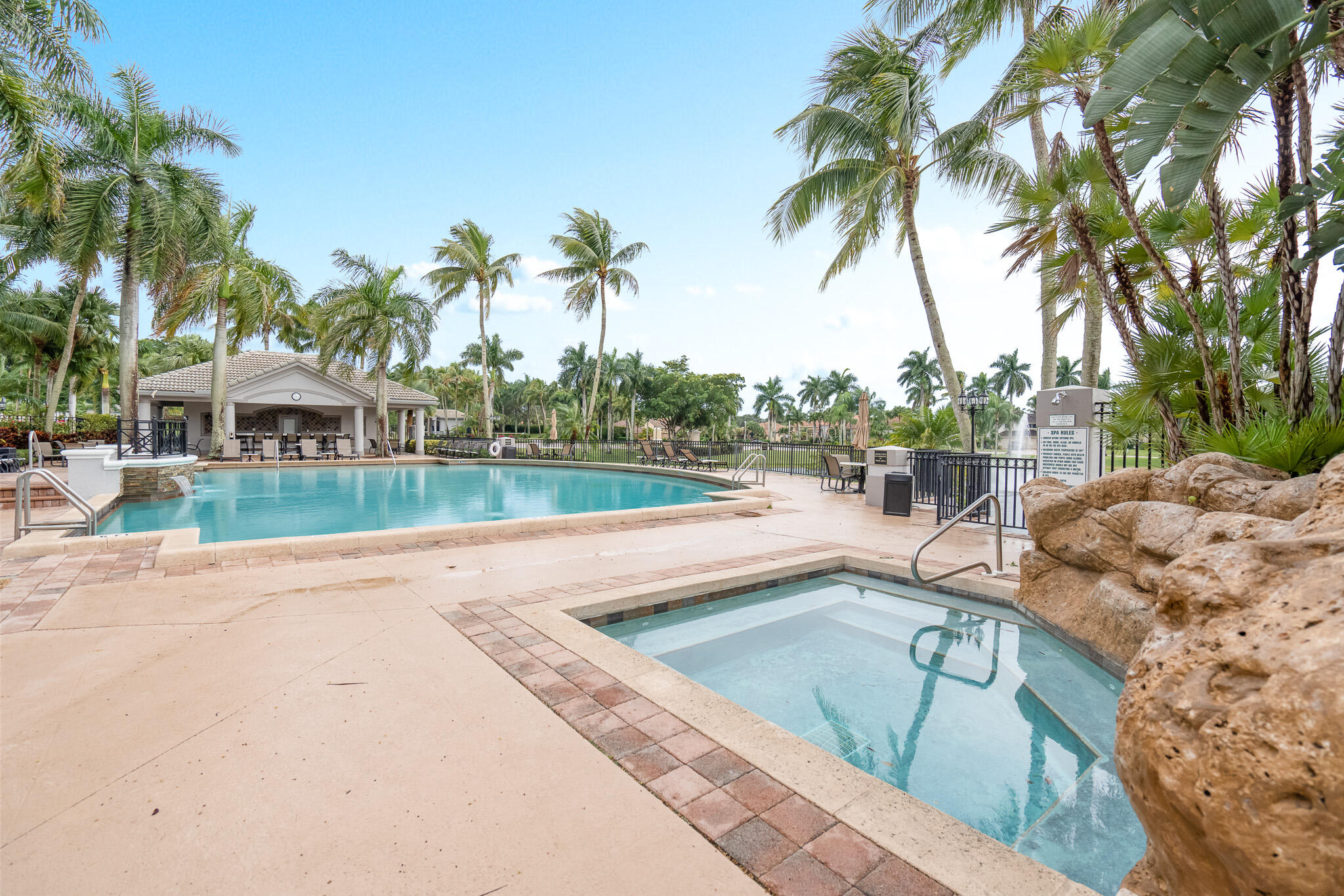 19916 Dinner Key Drive Boca Raton, FL 33498 - Photo 69 of 73 a view of a swimming pool with a patio