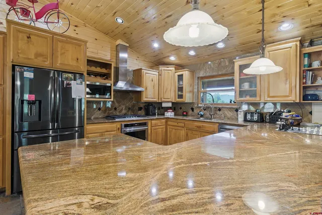 a large swimming pool with a outdoor seating space