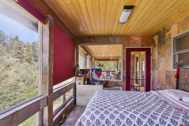 a bed room with a bed and a dresser