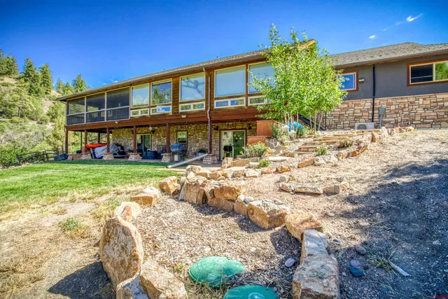 a view of a house with a yard