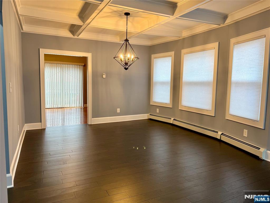 59 Laurel Avenue, Unit RIGHT SIDE Kearny, NJ 07032 - Photo 2 of 16 wooden floor in an empty room with a window