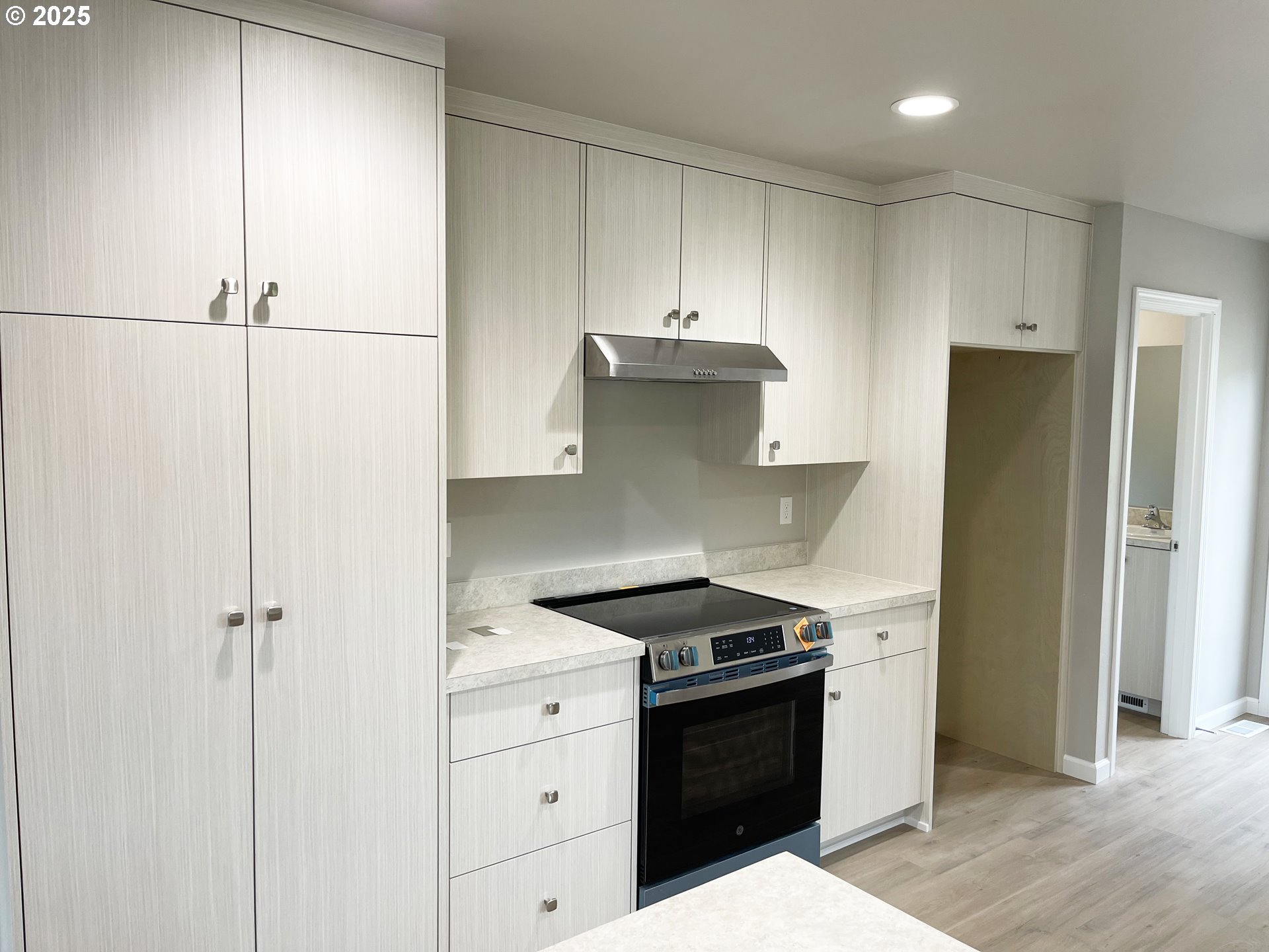 310 North Chase Street Heppner, OR 97836 - Photo 3 of 14 a kitchen with stainless steel appliances a refrigerator and cabinets