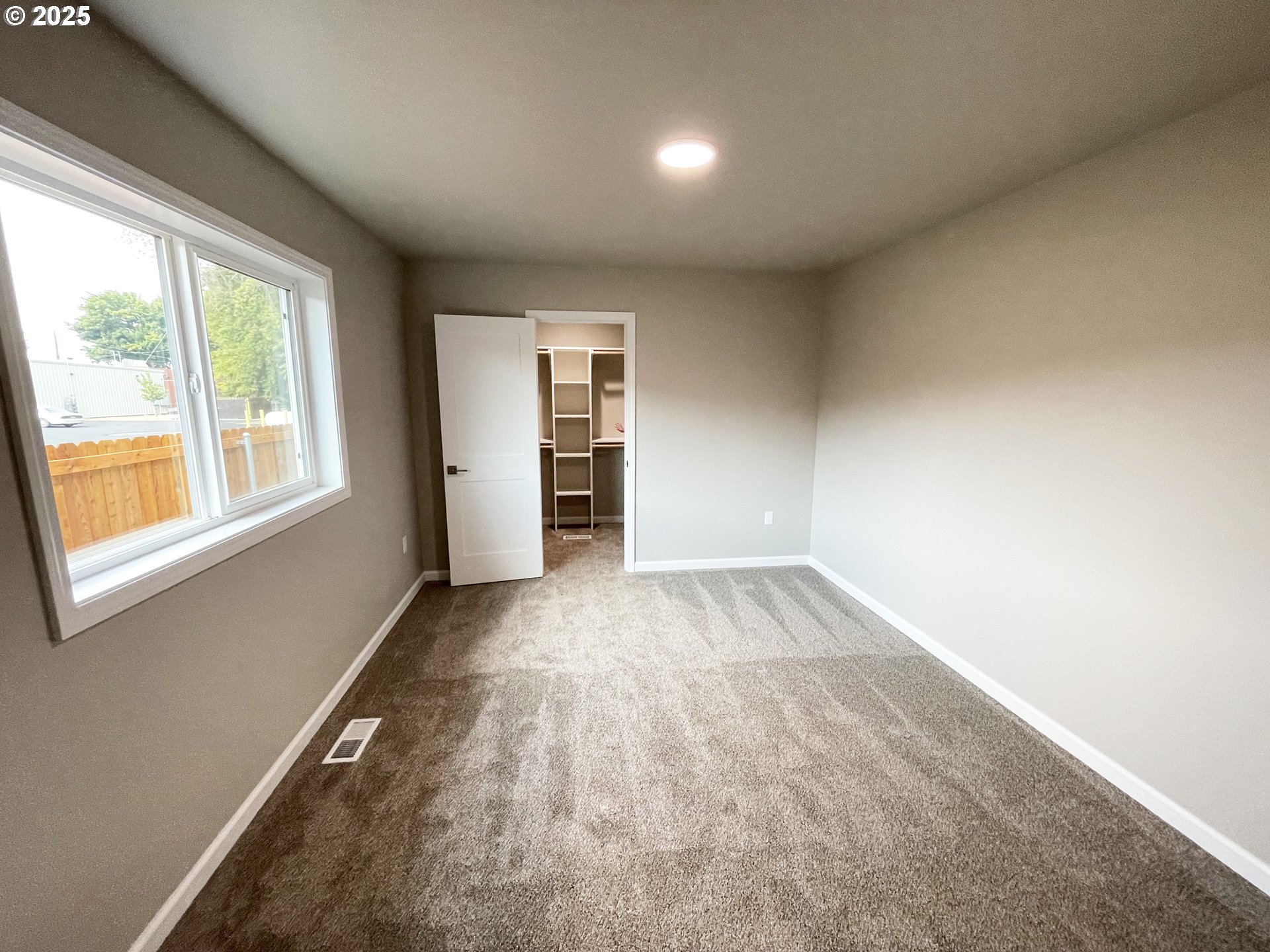 310 North Chase Street Heppner, OR 97836 - Photo 9 of 14 an empty room with windows