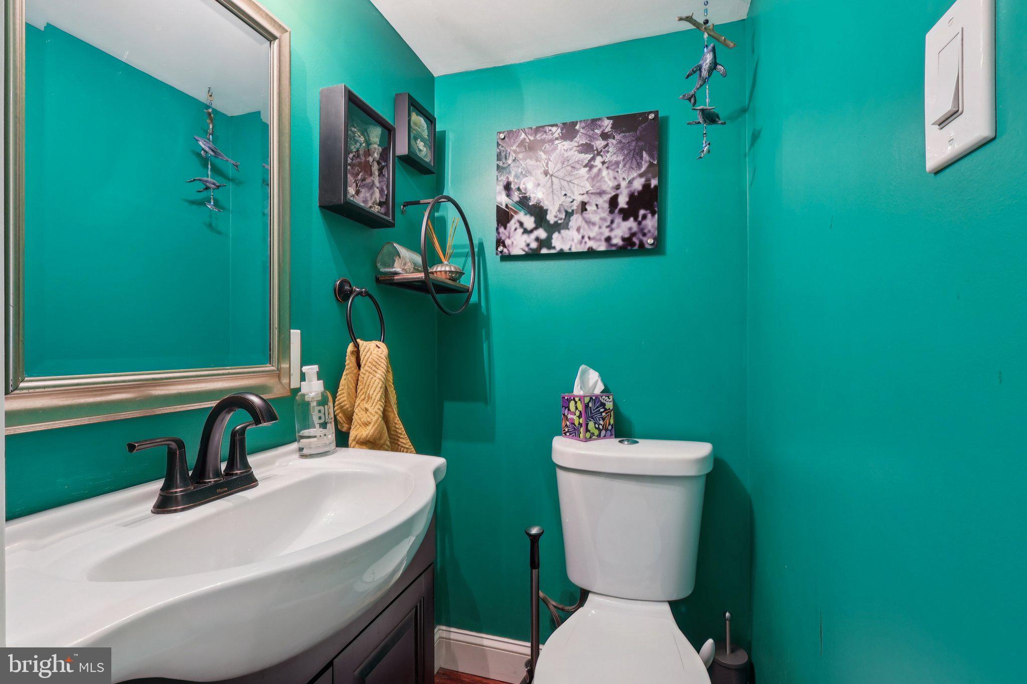 3442 Holyoke Road Philadelphia, PA 19114 - Photo 19 of 35 a bathroom with a toilet a sink and mirror