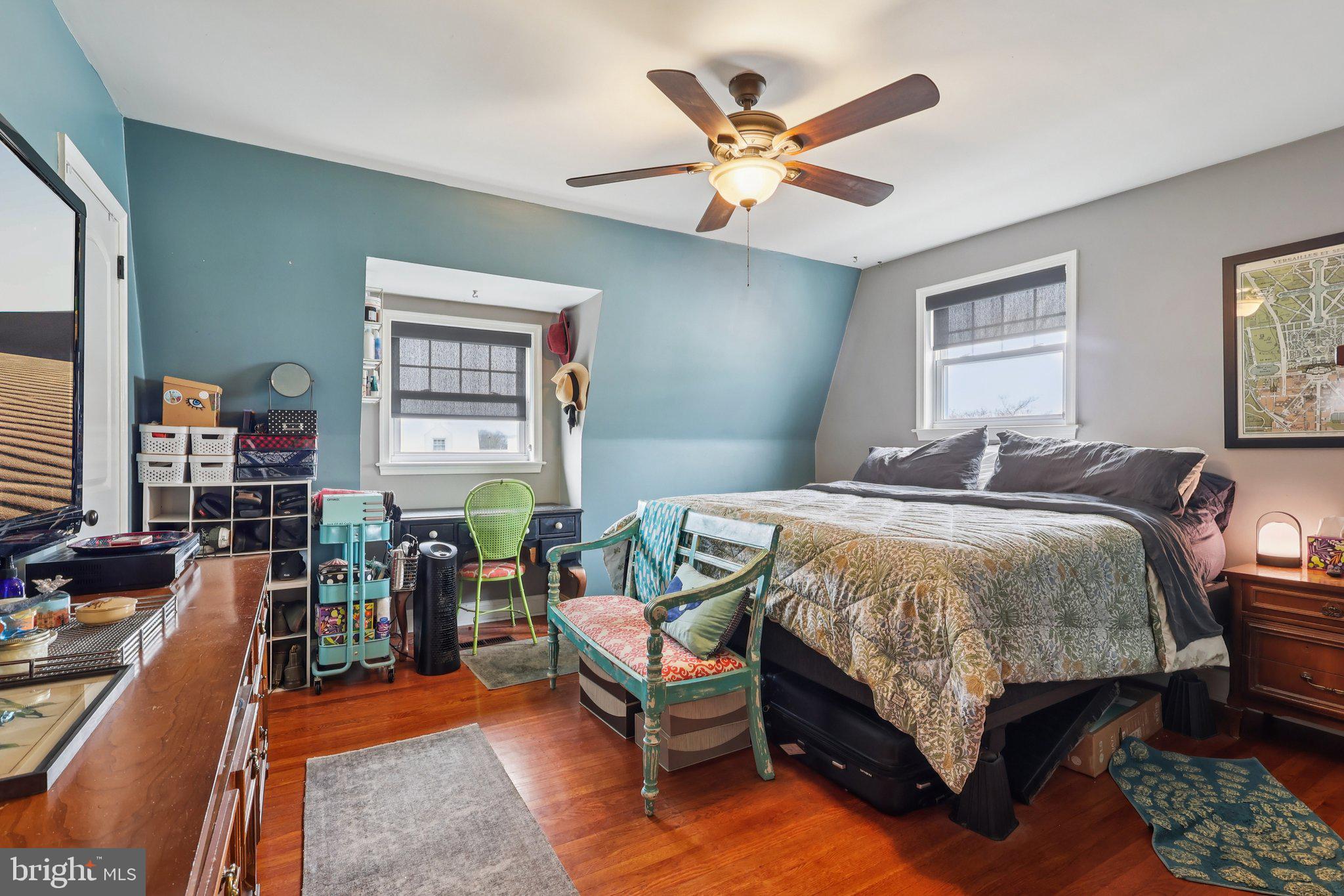 3442 Holyoke Road Philadelphia, PA 19114 - Photo 22 of 35 a bedroom with a bed a chandelier and a dresser