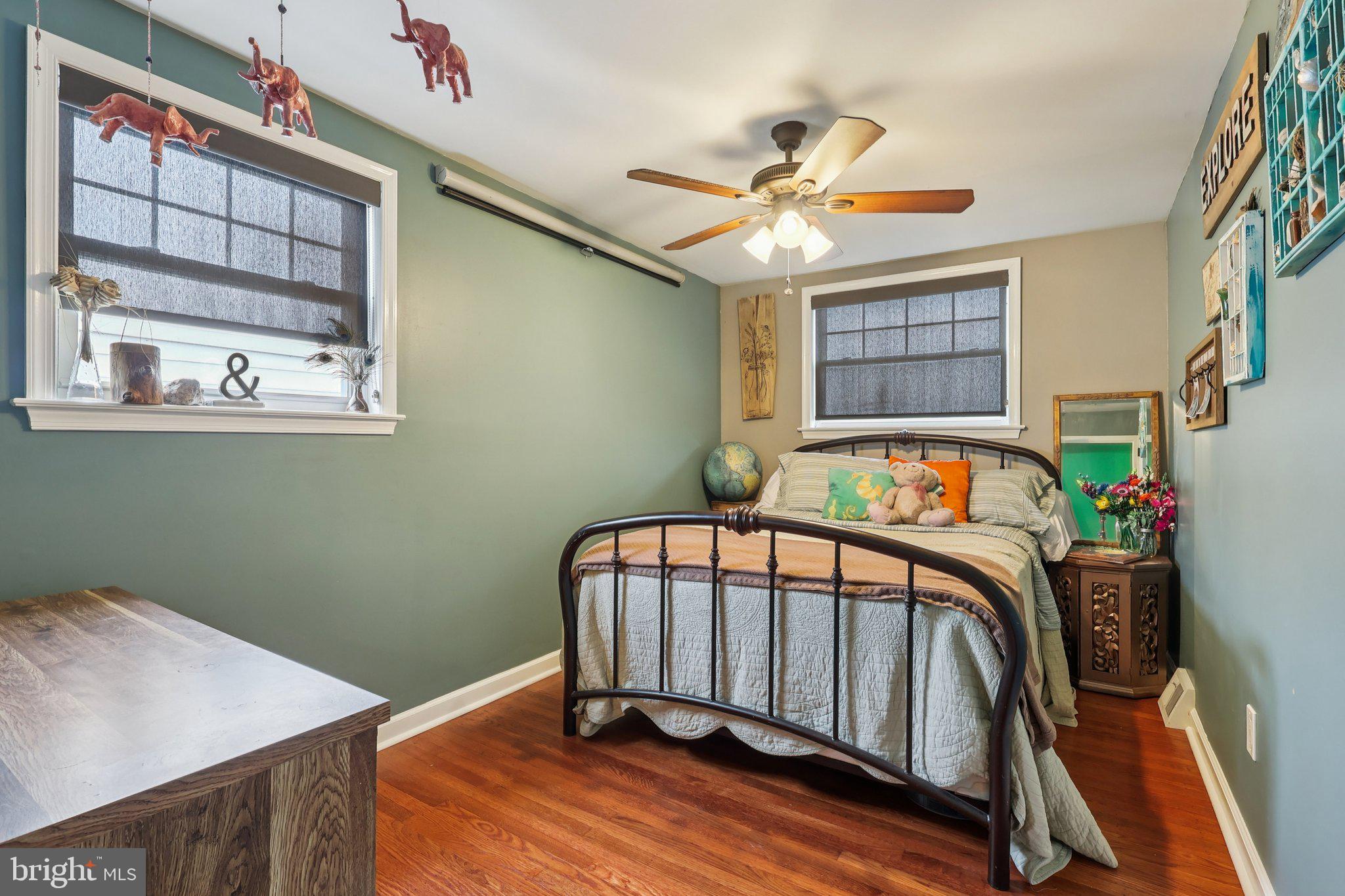3442 Holyoke Road Philadelphia, PA 19114 - Photo 24 of 35 a bedroom with a bed and a chandelier