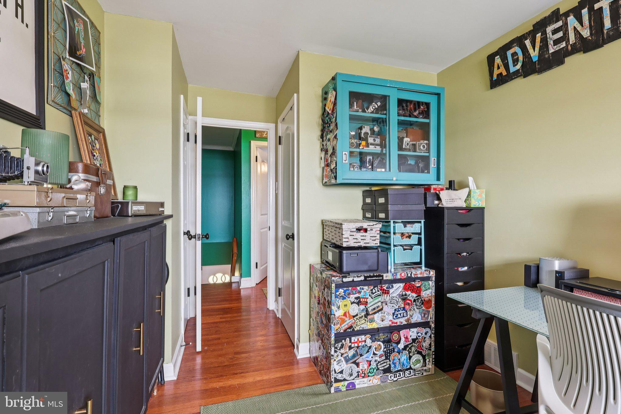 3442 Holyoke Road Philadelphia, PA 19114 - Photo 25 of 35 a view of a hallway with workspace and wooden floor