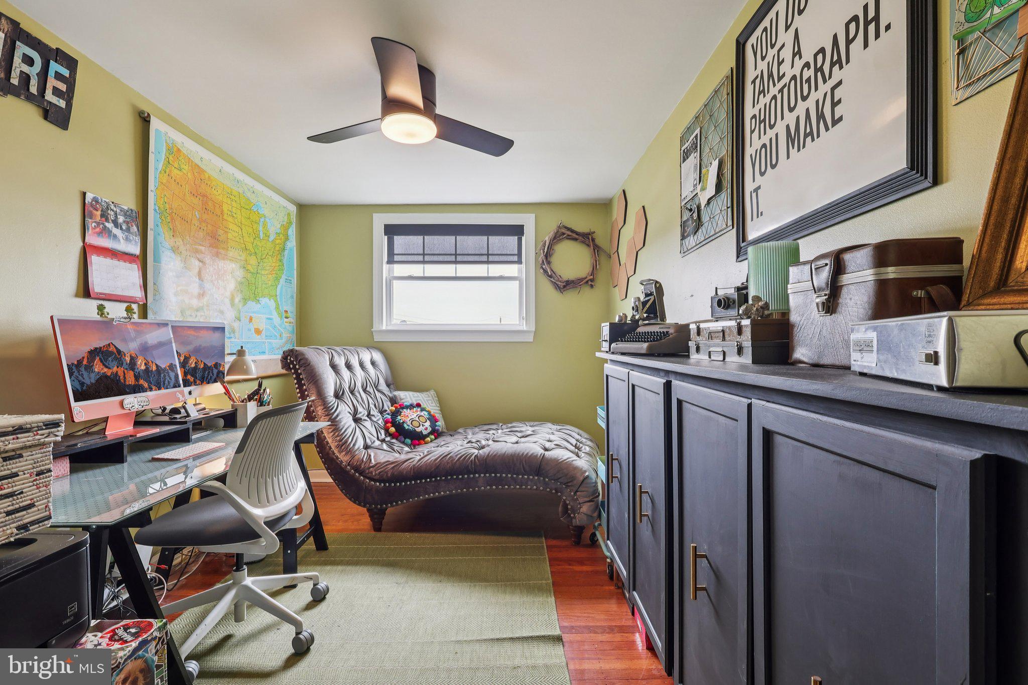 3442 Holyoke Road Philadelphia, PA 19114 - Photo 26 of 35 a bedroom with a bed and a chandelier