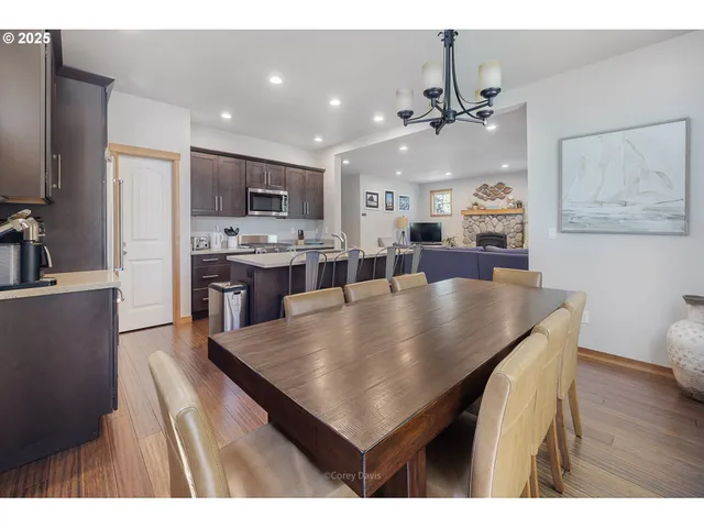 a dining room with kitchen island a table and chairs