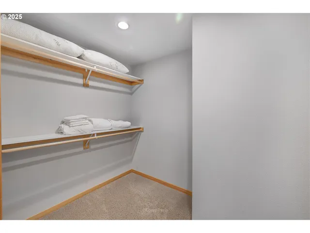 a bedroom with a bed window and a desk