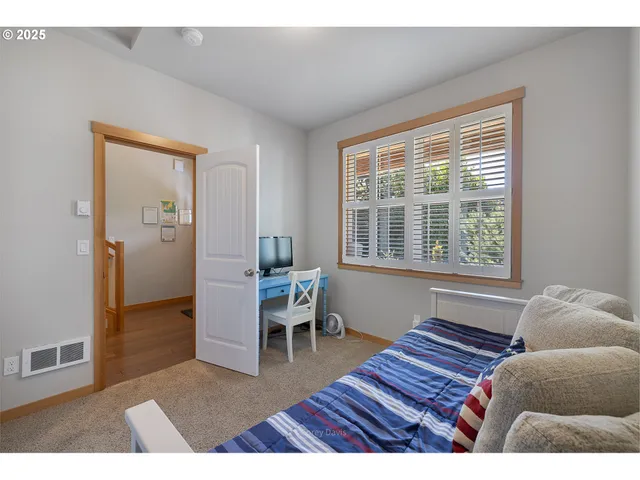 a bathroom with a sink mirror and vanity