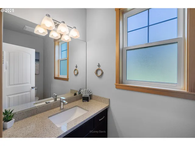 a view of porch with two chairs and a potted plant