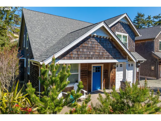 a front view of house with a garden