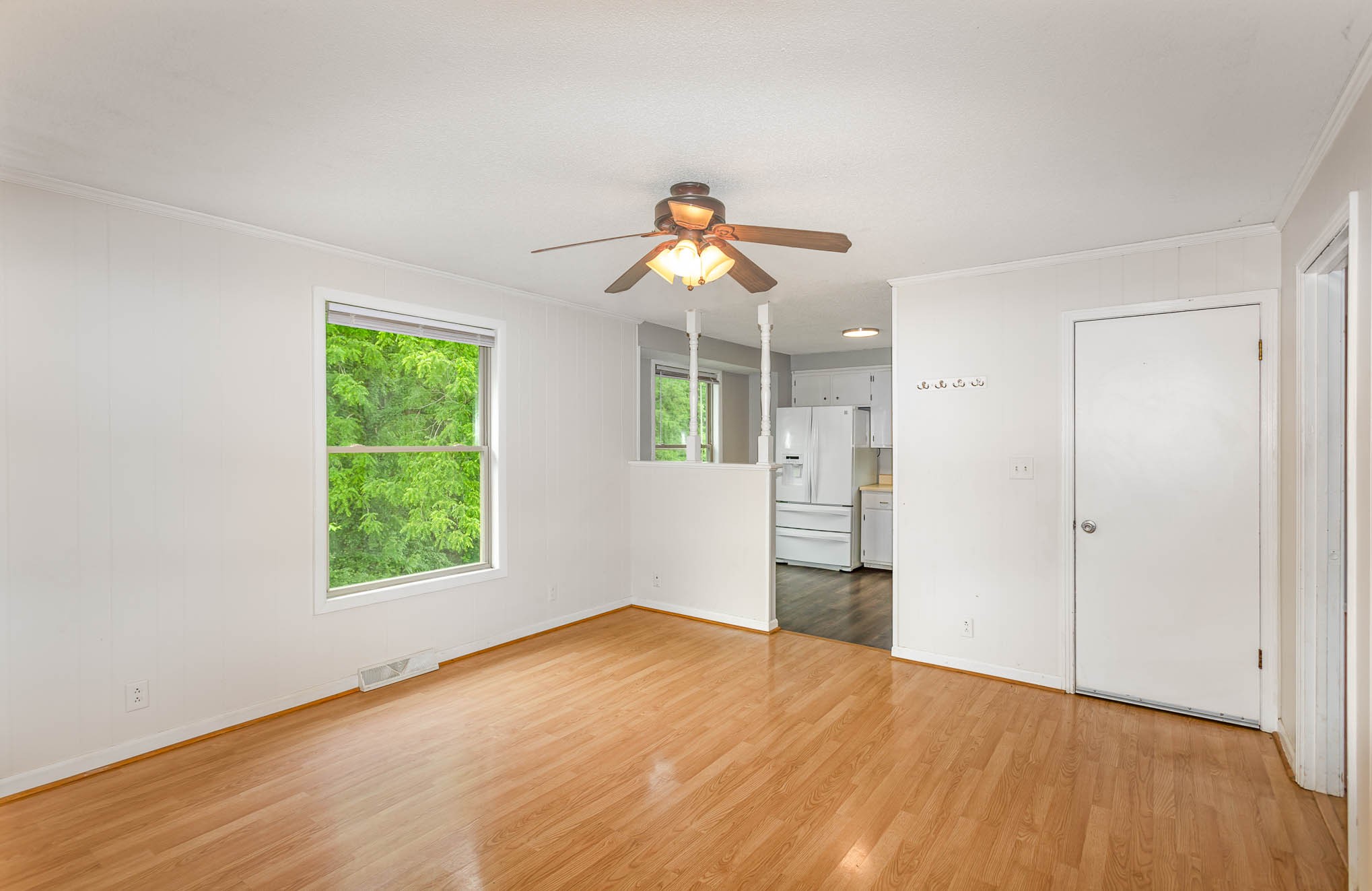 340 Dean Road Clarksville, TN 37040 - Photo 8 of 30 wooden floor in an empty room with a window