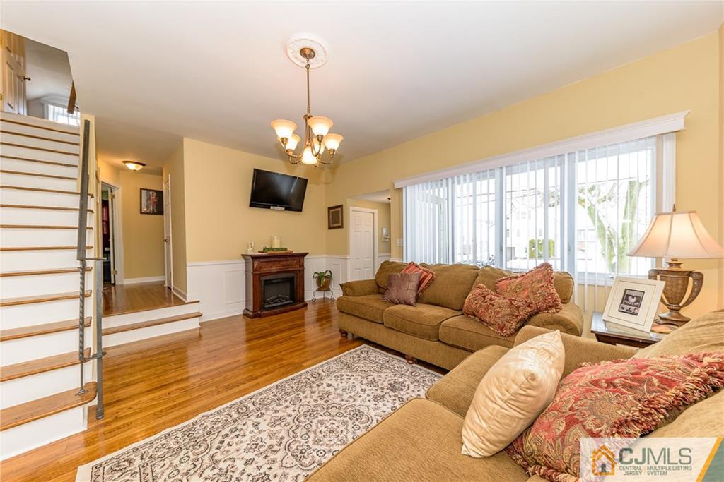7 Exeter Road Fords, NJ 08863 - Photo 2 of 25 a living room with furniture and a fireplace