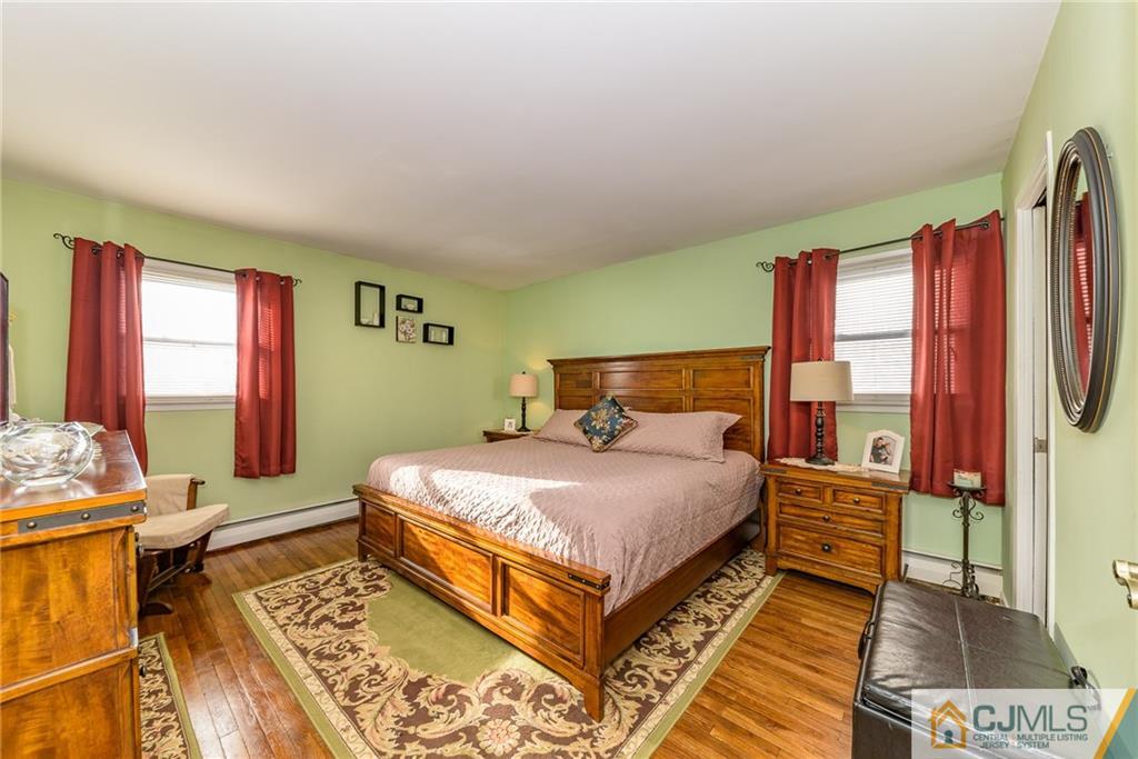 7 Exeter Road Fords, NJ 08863 - Photo 13 of 25 a bedroom with a bed and wooden floor