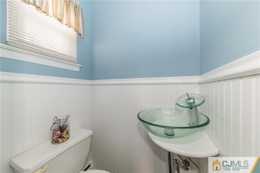 7 Exeter Road Fords, NJ 08863 - Photo 15 of 25 a bathroom with a sink and a mirror