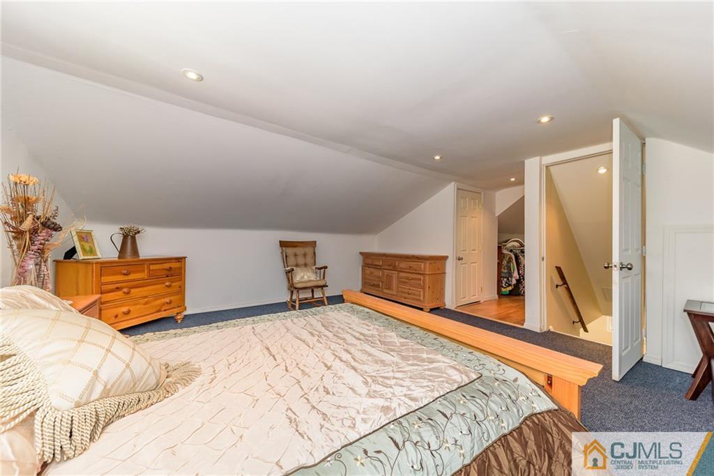 7 Exeter Road Fords, NJ 08863 - Photo 17 of 25 a bed room with a bed and a television