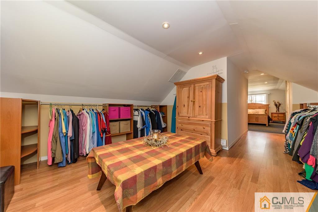7 Exeter Road Fords, NJ 08863 - Photo 18 of 25 a bedroom with a bed and a wooden floor