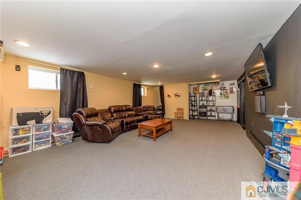 7 Exeter Road Fords, NJ 08863 - Photo 20 of 25 a living room with furniture and a flat screen tv