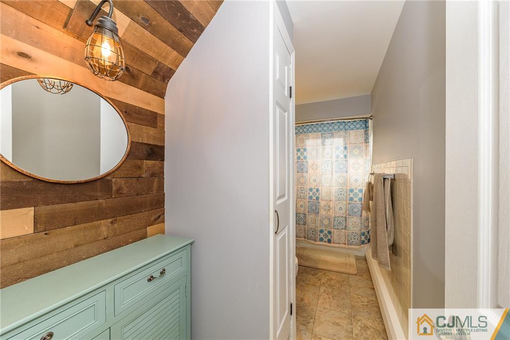 7 Exeter Road Fords, NJ 08863 - Photo 9 of 25 a bathroom with a sink and a mirror