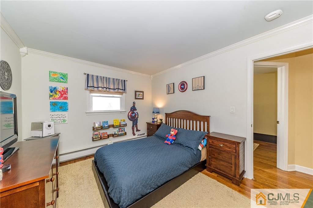 7 Exeter Road Fords, NJ 08863 - Photo 10 of 25 a bedroom with furniture and a window