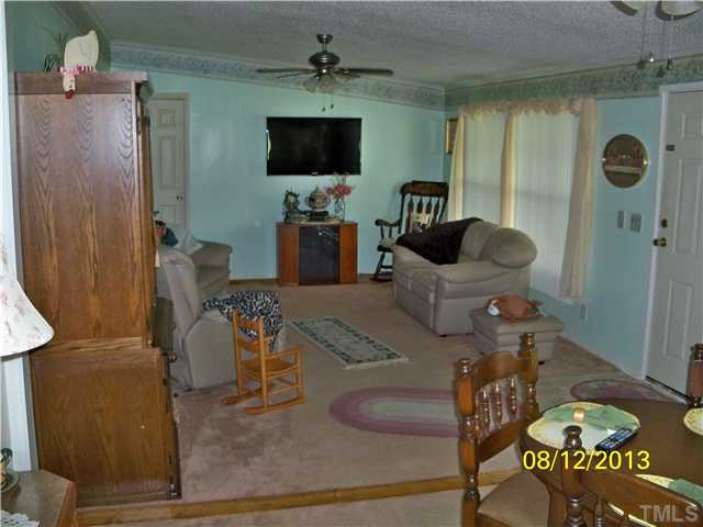 7300 Martin Road Zebulon, NC 27597 - Photo 9 of 9 a living room with furniture and a flat screen tv