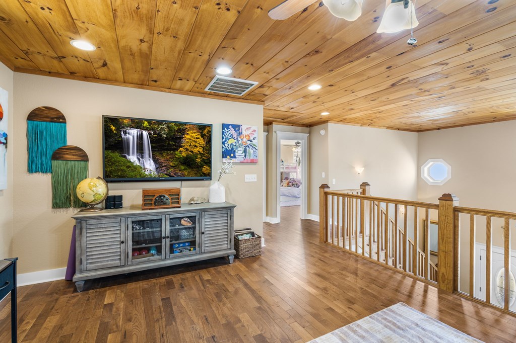 961 South Brooks Cove Road Hayesville, NC 28904 - Photo 15 of 55 a view of a room with wooden floor and furniture