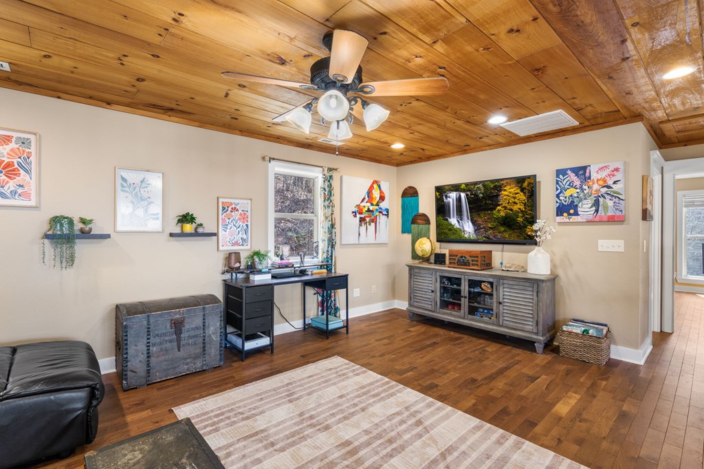 961 South Brooks Cove Road Hayesville, NC 28904 - Photo 16 of 55 a living room with furniture and a flat screen tv