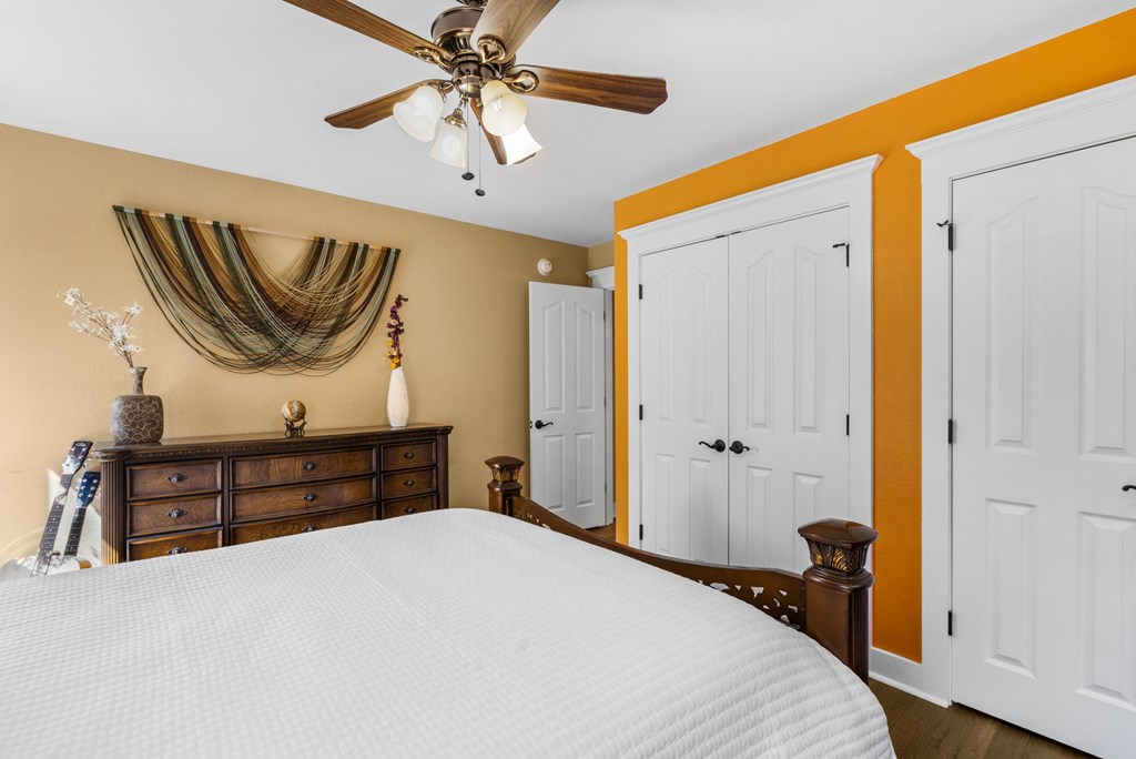 961 South Brooks Cove Road Hayesville, NC 28904 - Photo 20 of 55 a bedroom with a bed and a chandelier