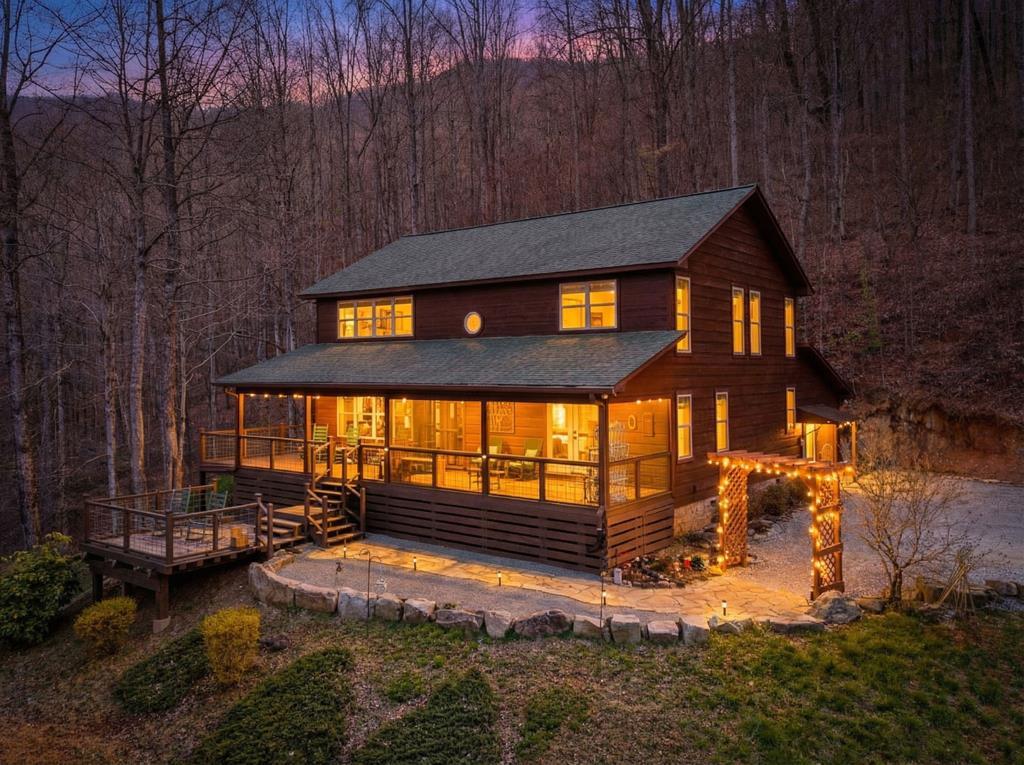 961 South Brooks Cove Road Hayesville, NC 28904 - Photo 2 of 55 a backyard of a house with a yard fire pit and outdoor seating