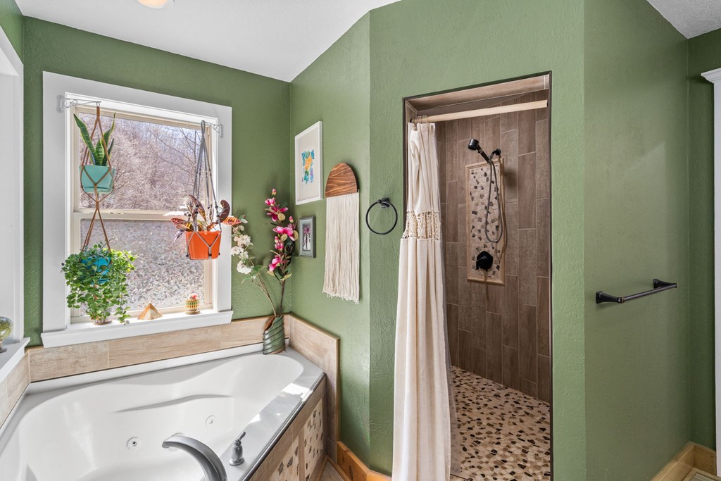 961 South Brooks Cove Road Hayesville, NC 28904 - Photo 24 of 55 a bathroom with a tub and a window