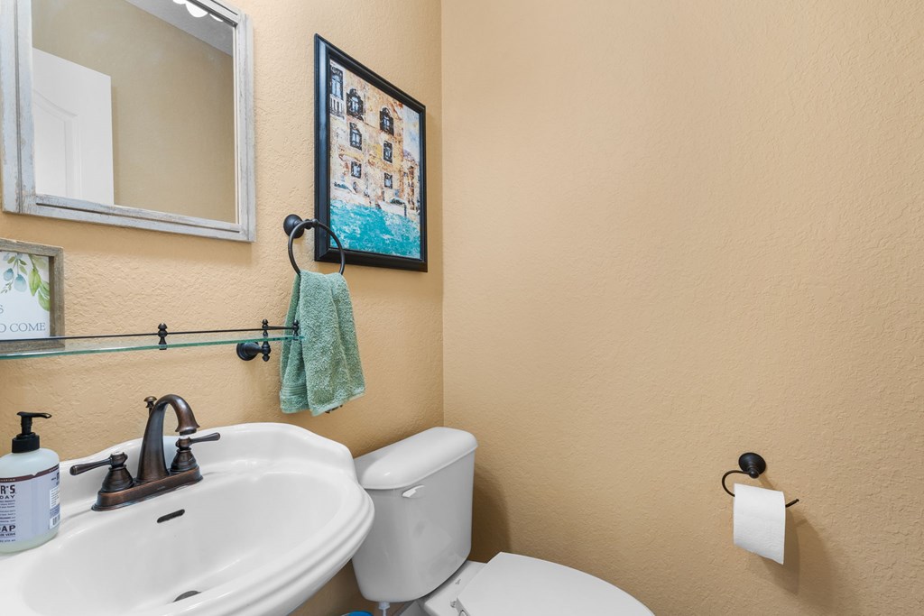 961 South Brooks Cove Road Hayesville, NC 28904 - Photo 28 of 55 a bathroom with a toilet sink and mirror