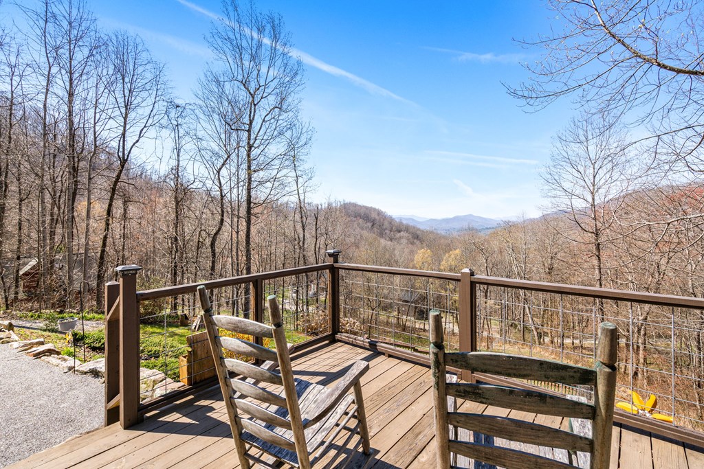 961 South Brooks Cove Road Hayesville, NC 28904 - Photo 4 of 55 a view of a balcony with wooden floor and fence