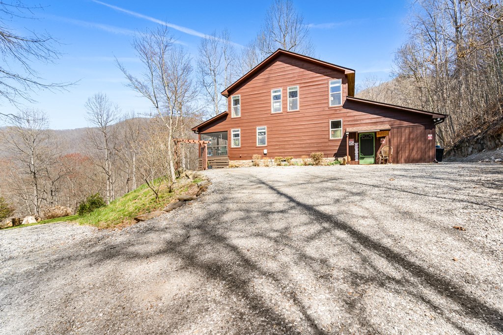 961 South Brooks Cove Road Hayesville, NC 28904 - Photo 41 of 55 a front view of a house with a yard