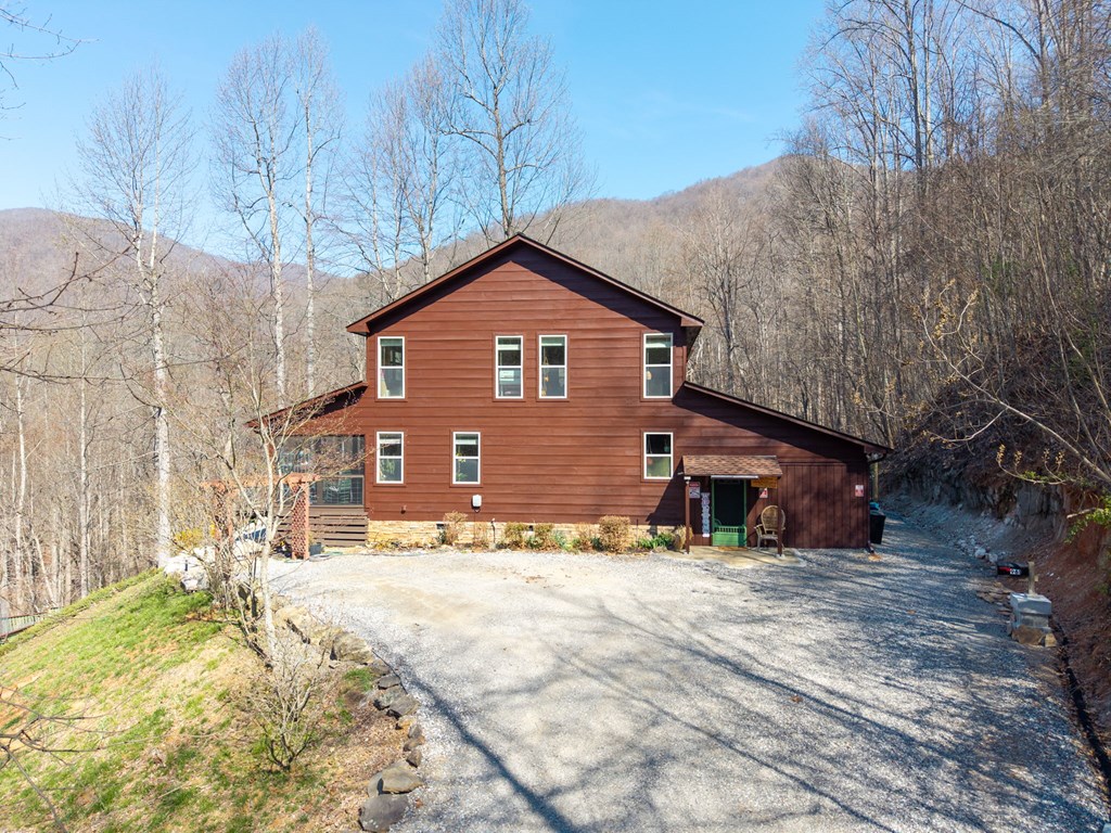 961 South Brooks Cove Road Hayesville, NC 28904 - Photo 42 of 55 a view of a house with a yard covered in snow