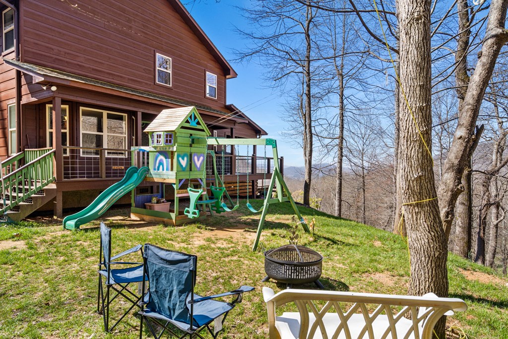 961 South Brooks Cove Road Hayesville, NC 28904 - Photo 46 of 55 a view of a house with backyard water fountain and a patio