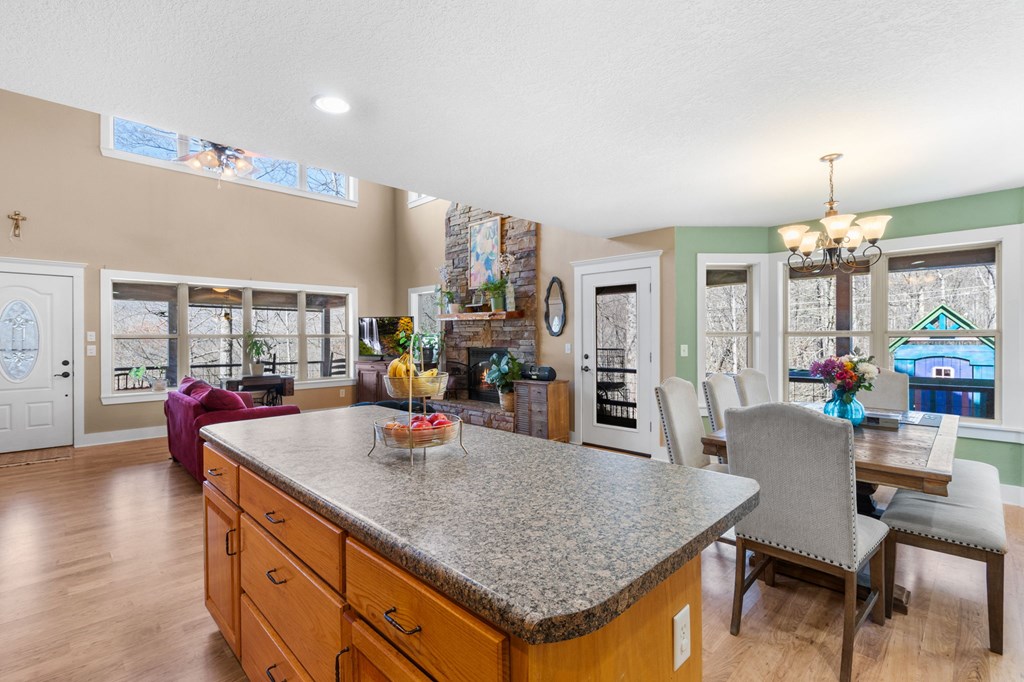 961 South Brooks Cove Road Hayesville, NC 28904 - Photo 10 of 55 a kitchen with granite countertop a table and chairs in it