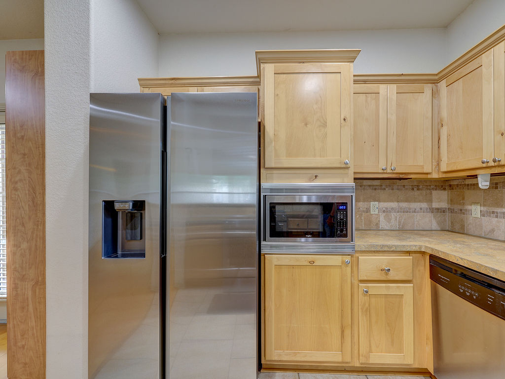 9707 Anderson Mill Road, Unit 22 Austin, TX 78750 - Photo 15 of 39 Culinary convenience with modern stainless steel appliances and abundant cabinetry.