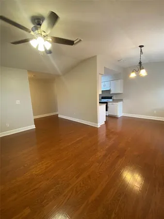 a view of a kitchen with a sink a kitchen stove and a window